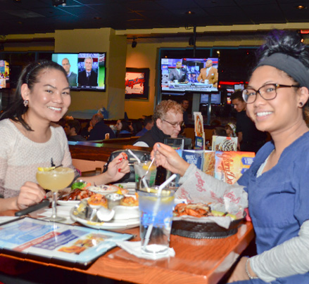 Two young ladies enjoying a meal at Glory Days Grill.