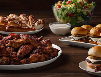 Catering Spread with Pretzels, Wings, Burgers and Salad
