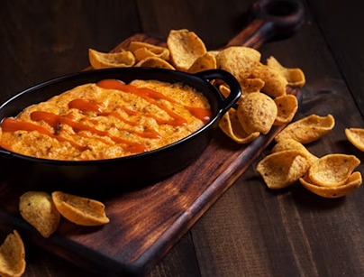 Buffalo Chicken Dip served with Fritos® Scoops®