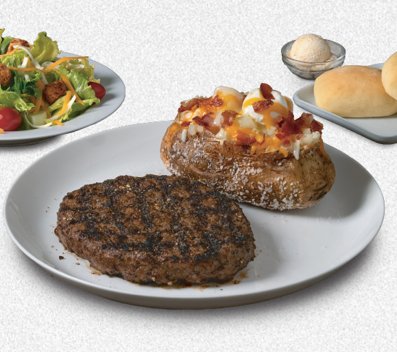 Prime Time Sundays promo image with steak, baked potato, salad and warm rolls with butter